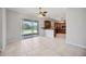 Bright and open kitchen area with sliding glass doors to the backyard and a tennis court at 17809 Howling Wolf Run, Parrish, FL 34219