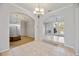 Bright living space with tile and wood floors, archways, and neutral walls at 17809 Howling Wolf Run, Parrish, FL 34219