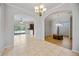 Open living space with tile floors, archways, and views to a dining room at 17809 Howling Wolf Run, Parrish, FL 34219