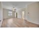 Spacious main bedroom with a ceiling fan, large windows, and hardwood flooring at 17809 Howling Wolf Run, Parrish, FL 34219