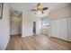Spacious primary bedroom with wood-look floors, closet, and bathroom access at 17809 Howling Wolf Run, Parrish, FL 34219