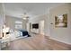Comfortable bedroom featuring a ceiling fan, king size bed and hardwood flooring at 17809 Howling Wolf Run, Parrish, FL 34219