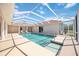 A swimming pool enclosed in a screened enclosure with outdoor seating and a beautifully manicured lawn at 17809 Howling Wolf Run, Parrish, FL 34219