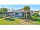 Beautifully landscaped backyard with a screened pool area and meticulously maintained lawn at 18115 Littleton Pl, Bradenton, FL 34202