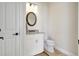 Well-lit half bathroom featuring granite counters, modern fixtures, and tile floors at 18115 Littleton Pl, Bradenton, FL 34202