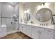 Spa-like bathroom with a soaking tub, walk-in shower, and double vanity sinks at 18115 Littleton Pl, Bradenton, FL 34202
