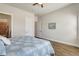 This bedroom offers neutral paint, wood-look flooring, and ensuite bathroom access at 18115 Littleton Pl, Bradenton, FL 34202
