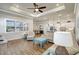 Bright living room with wood-look tile, plantation shutters, recessed lighting, and open concept at 18115 Littleton Pl, Bradenton, FL 34202