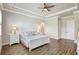 Spacious main bedroom with tray ceiling, neutral walls, and wood look flooring at 18115 Littleton Pl, Bradenton, FL 34202