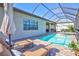 An inviting pool area with lounge chairs and an umbrella for relaxation, along with a spa for ultimate comfort at 18115 Littleton Pl, Bradenton, FL 34202