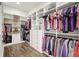 Spacious walk-in closet with custom shelving and drawers for optimal storage and organization at 18115 Littleton Pl, Bradenton, FL 34202