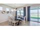 Elegant dining room with lake view and stylish decor, perfect for gatherings at 18224 Beach Ranch Ter, Lakewood Ranch, FL 34211