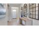 Bright foyer features neutral tile, attractive wall decor, and a welcoming, light-filled entrance at 18224 Beach Ranch Ter, Lakewood Ranch, FL 34211