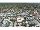 An aerial panorama capturing a quaint coastal town dotted with residences and shops at 20 Whispering Sands Dr # 301, Sarasota, FL 34242