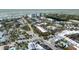 Aerial view of a coastal town, highlighting residential and commercial areas by the ocean at 20 Whispering Sands Dr # 301, Sarasota, FL 34242