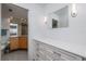 A look into the bathroom with wood cabinets, modern countertops, and vanity area at 20 Whispering Sands Dr # 301, Sarasota, FL 34242