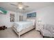 Bright bedroom features wood floors, wall art, and relaxing decor at 20 Whispering Sands Dr # 301, Sarasota, FL 34242