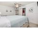 Bedroom features wood floors and ensuite bathroom with white trim and doors at 20 Whispering Sands Dr # 301, Sarasota, FL 34242