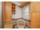 Bright desk area features granite counters, storage, and natural light from the window at 20 Whispering Sands Dr # 301, Sarasota, FL 34242