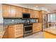 Updated kitchen with stainless steel appliances, wooden cabinets and granite countertops at 20 Whispering Sands Dr # 301, Sarasota, FL 34242