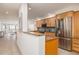 Modern kitchen with stainless steel appliances, granite countertops, and wooden cabinetry at 20 Whispering Sands Dr # 301, Sarasota, FL 34242