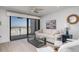 Inviting living room with comfortable seating, ocean view balcony, and stylish decor at 20 Whispering Sands Dr # 301, Sarasota, FL 34242