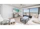 Bright and airy living room with sliding glass doors to a balcony with ocean views at 20 Whispering Sands Dr # 301, Sarasota, FL 34242