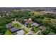 An aerial view showing the home's location in a residential area with mature trees and nearby amenities at 2114 147Th E Ct, Bradenton, FL 34212