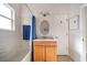 Standard bathroom with a tub-shower combo, vanity and a oval mirror at 2114 147Th E Ct, Bradenton, FL 34212