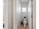 A well-lit, neutral half-bathroom with a window and a standard toilet at 2114 147Th E Ct, Bradenton, FL 34212