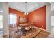 Elegant dining room featuring a stylish chandelier, rich wall color, and classic furnishings at 2114 147Th E Ct, Bradenton, FL 34212