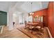 Classic dining room with wood flooring, a large hutch, and a coffered ceiling at 2114 147Th E Ct, Bradenton, FL 34212