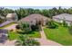 Beautiful home featuring a lush landscaped front yard, brick walkway, and inviting entrance at 2114 147Th E Ct, Bradenton, FL 34212