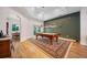 Open game room with a pool table, vintage-themed décor, leading to the dining area, ideal for entertaining guests at 2114 147Th E Ct, Bradenton, FL 34212