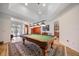 Entertaining game room with a pool table, vintage decor, and great lighting for an enjoyable leisure experience at 2114 147Th E Ct, Bradenton, FL 34212