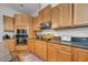 Stylish kitchen with wooden cabinets, granite countertops, stainless appliances, and plenty of storage space at 2114 147Th E Ct, Bradenton, FL 34212