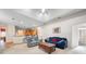 Comfortable living room boasts neutral carpet, an open layout, and access to the kitchen at 2114 147Th E Ct, Bradenton, FL 34212