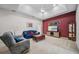 Cozy living area with plush seating, a television, and tasteful decor offers relaxing space at 2114 147Th E Ct, Bradenton, FL 34212