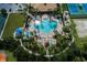 Aerial view of community pool and amenities, surrounded by palm trees at 2160 Chenille Ct, Venice, FL 34292