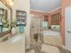 Bathroom featuring a separate shower and soaking tub, with stylish fixtures and neutral tile at 2160 Chenille Ct, Venice, FL 34292