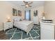 Serene bedroom featuring white furnishings, a cozy bed, and soft lighting, with a neutral color palette at 2160 Chenille Ct, Venice, FL 34292