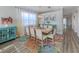 Bright dining space with luxury vinyl flooring, contemporary furnishings, and lots of natural light at 2160 Chenille Ct, Venice, FL 34292