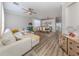 Bright open-concept living space with luxury vinyl flooring, contemporary furnishings, and lots of natural light at 2160 Chenille Ct, Venice, FL 34292