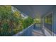 A spacious balcony surrounded by lush greenery and trees offers outdoor relaxation at 2230 Myakka Rd, Sarasota, FL 34240