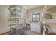 Bright bonus room featuring ample shelving, cabinets, and natural light at 2230 Myakka Rd, Sarasota, FL 34240