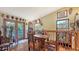 Dining area with wood table and chairs, with masks and sculptures adorning the walls at 2230 Myakka Rd, Sarasota, FL 34240