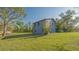 Two-story house with blue siding and ample yard space at 2230 Myakka Rd, Sarasota, FL 34240