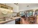 Cozy kitchen with stainless steel appliances and an open view to the dining room at 2230 Myakka Rd, Sarasota, FL 34240