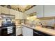 Cozy kitchen with white cabinets, wood countertops, and modern appliances at 2230 Myakka Rd, Sarasota, FL 34240
