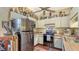Cozy kitchen with stainless steel appliances, wood floors and light-colored cabinets at 2230 Myakka Rd, Sarasota, FL 34240